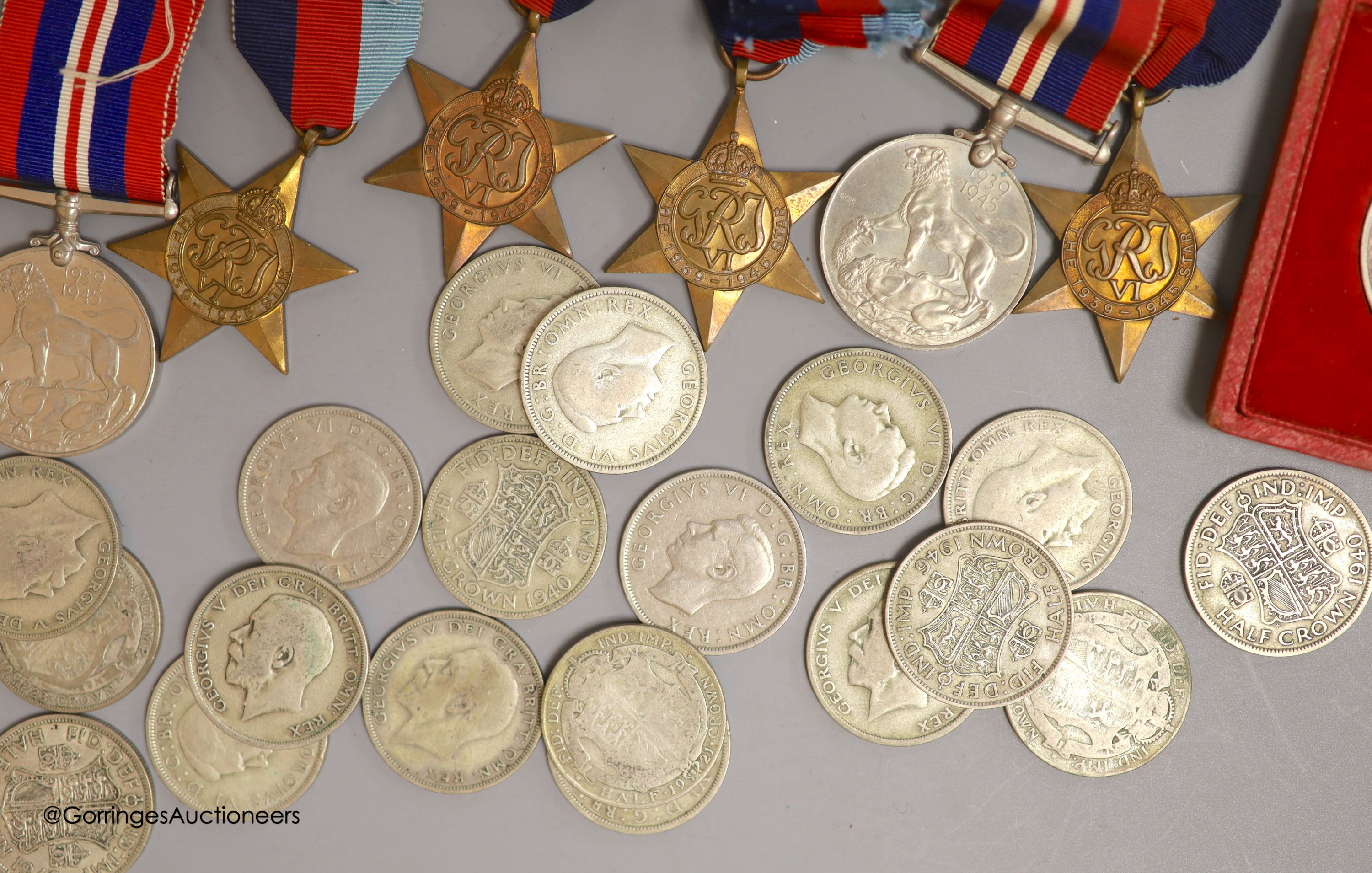 A quantity of coins and WWII medals